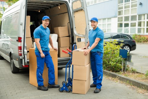 Loading furniture into a van for a Chelsfield removal job
