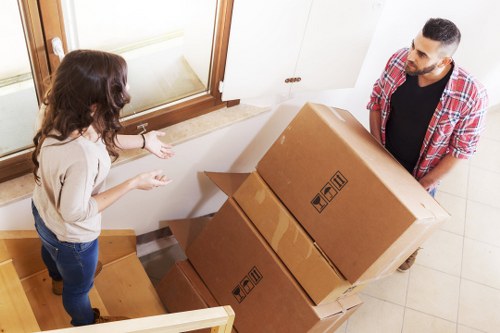 Local office move preparation with labelled boxes and workstations