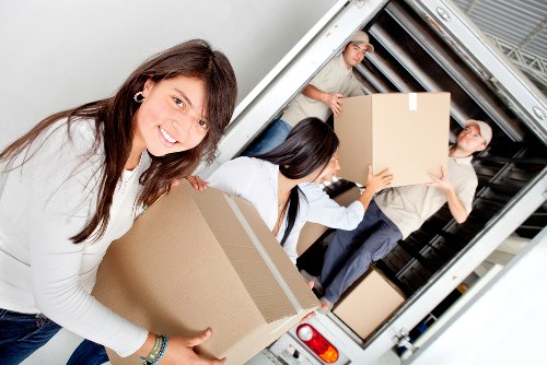Chelsfield moving service loading household furniture carefully