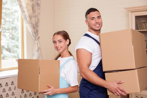 Local business relocation setup with office furniture and boxes