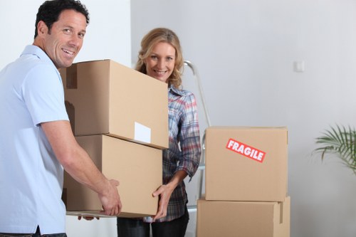 Professional movers handling furniture in a Chelsfield property
