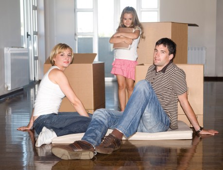 Mover handling boxes and furniture during a local house move in Chelsfield